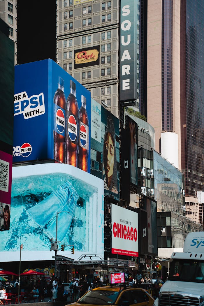 Dynamic view of Times Square with vivid billboards and towering NYC skyscrapers.